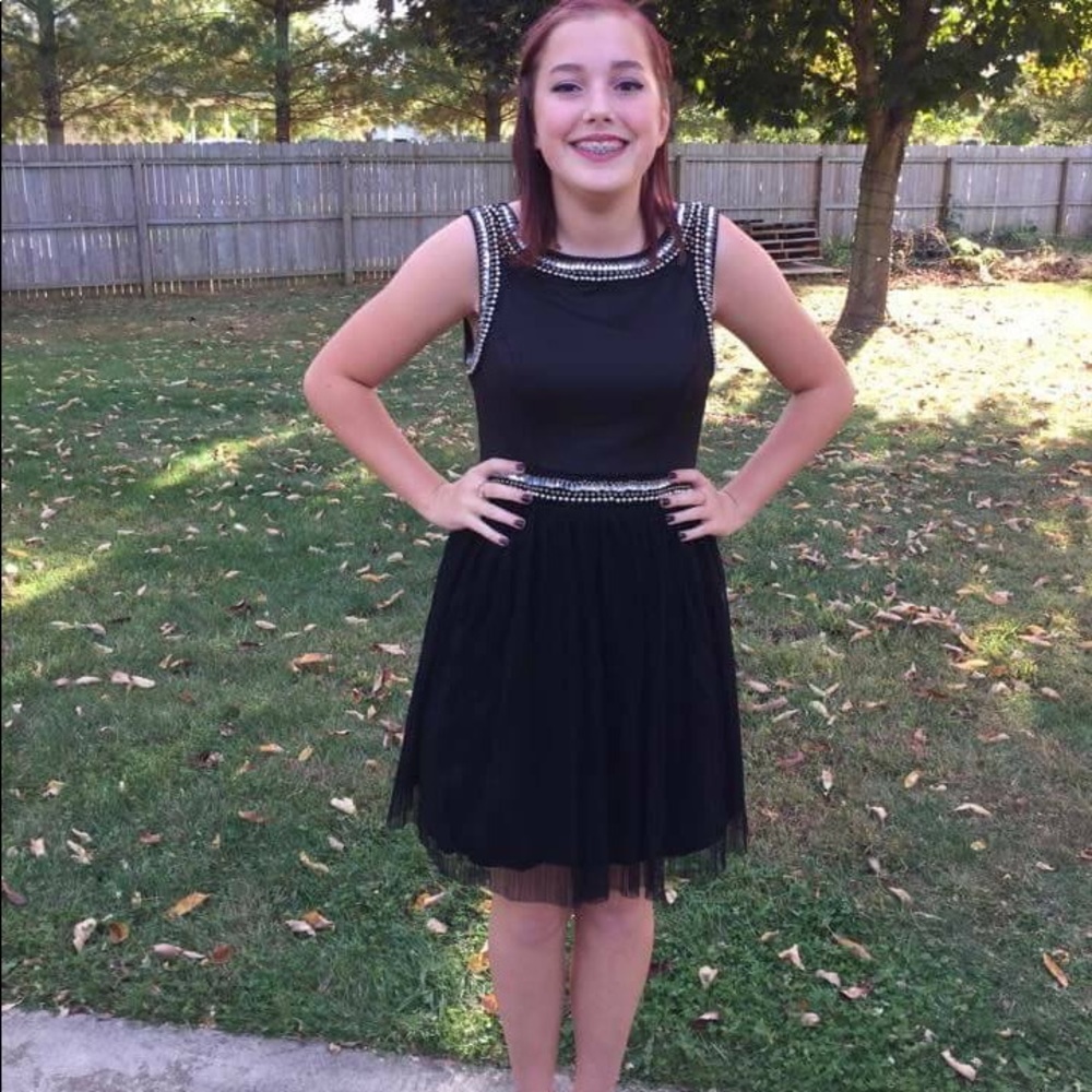 Black dress with sequin beading details.